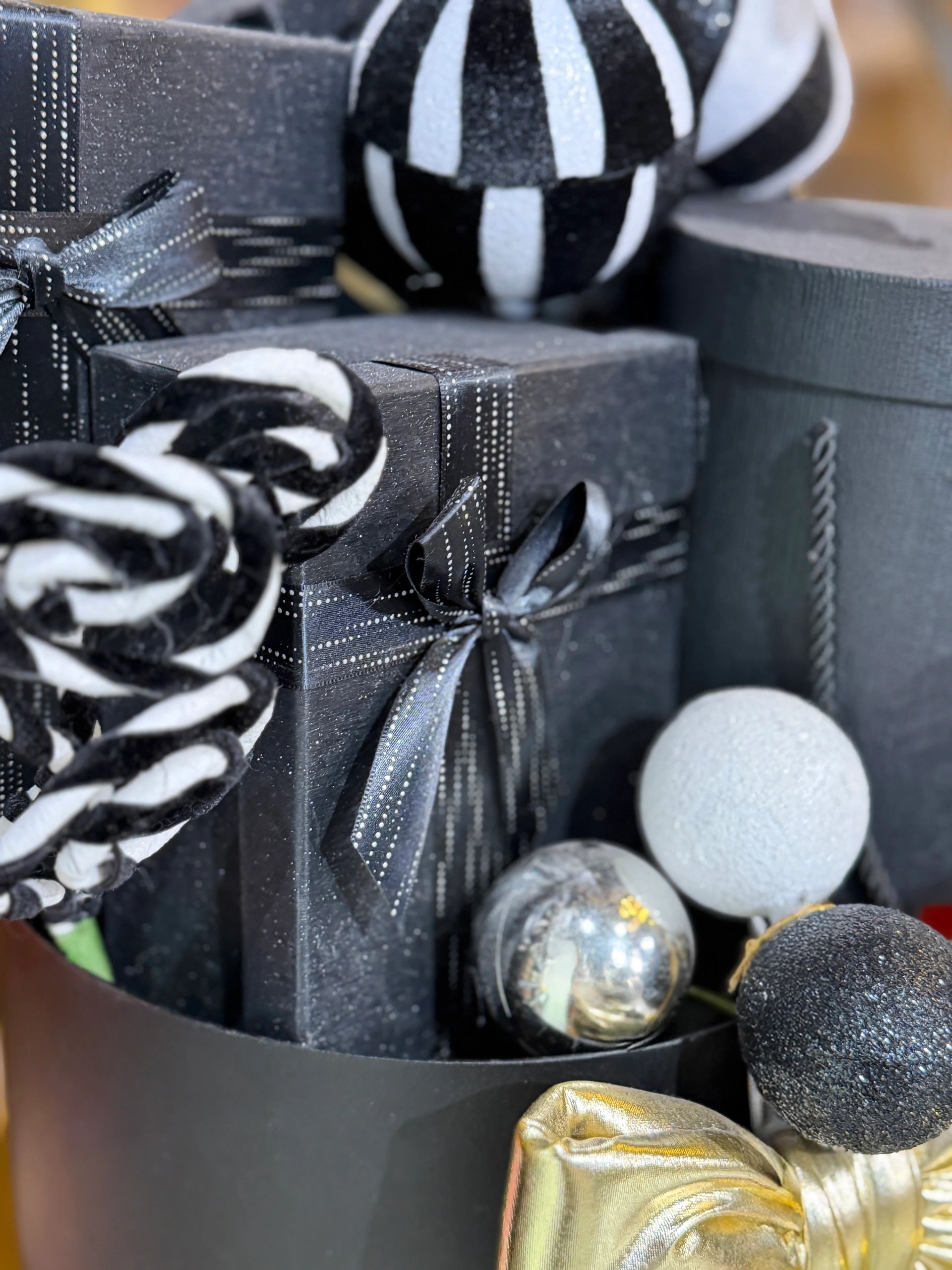 Luxury Christmas gift wrapping with gold and black accents